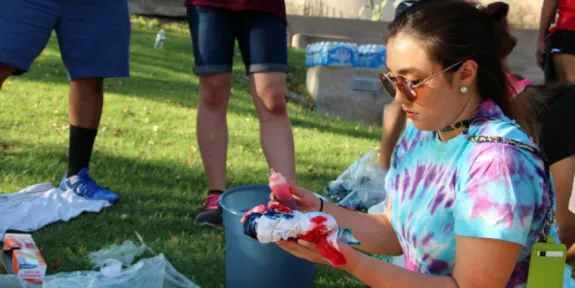 Tiedye shirt; jorts in the distance