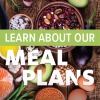 Learn about our meal plans text on top of image of nuts, berries, fruits.